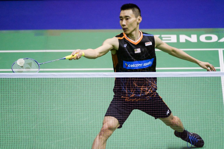 China’s Chen Long hits a shot against Malaysia’s Lee Chong Wei during the men’s singles final at the Hong Kong Open badminton tournament in Hong Kong on November 26, 2017. / AFP PHOTO / Isaac LAWRENCE