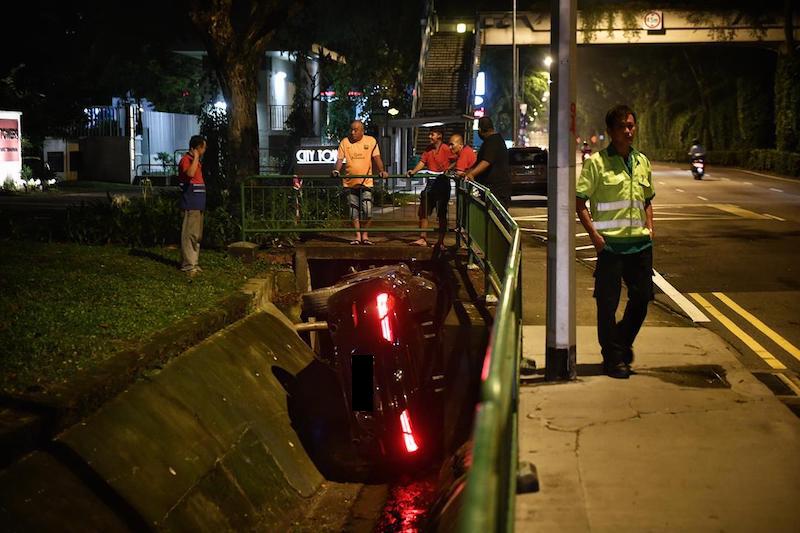 Sports car ends up in a ditch along Bukit Timah Road after an accident ...