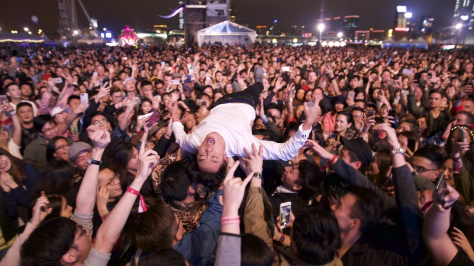 Supper Moment lead singer Sunny crowdsurfs on the last night of Clockenflap 2017. Photo by Somerly Ha.