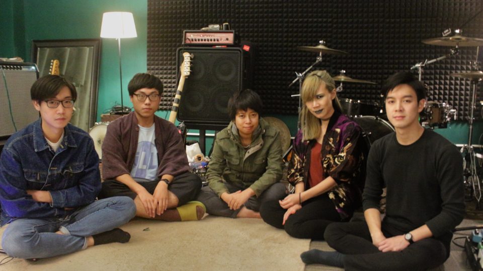 From left to right: Dave Cheng (guitar), Stan Chik (drums), Panicube (bass), Janice Lau (vocals), and Jason Cheng (guitar). Photo by Vicky Wong.