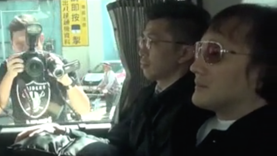Kwok Wing-hung (right) pictured in an unmarked police. Also known as “Shanghai Boy”, he is reported to be the former leader of the Wo Shing Wo triad society. Picture taken from OnTv clip