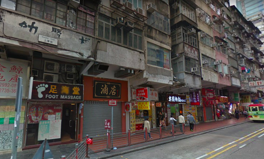 The suspect was arrested outside the shops on this street after officers received reports that a couple were slapped on Shanghai Street. Photo via Google Maps.