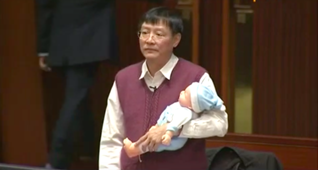 Trade unionist and former lawmaker Wong Kwok-hing argued in 2014 that paternity leave should be increased to seven days while carrying a toy doll.