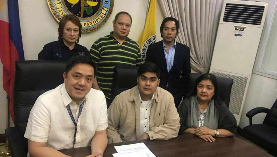Fratman Marc Ventura (center) and his lawyers at the Department of Justice. Photo by ABS-CBN News
