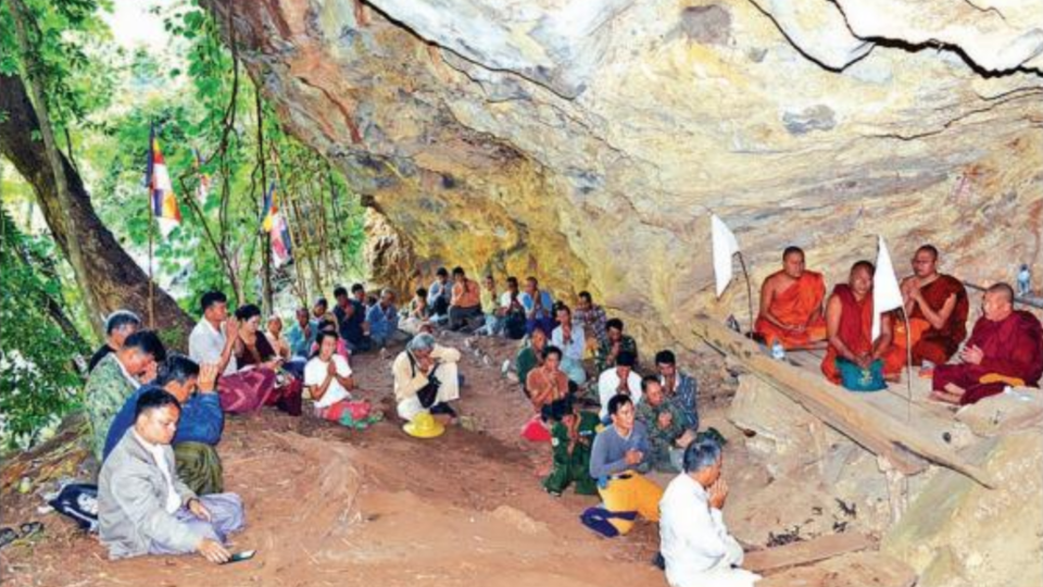 Local officials and residents receive the Five Precepts from the Mei Phone Sayadaw in a newly discovered cave in southern Shan State. Photo: Sai Zaw Latt