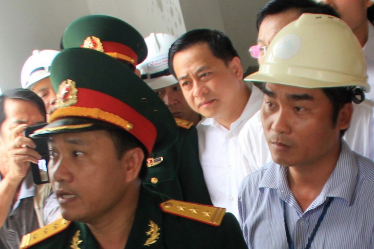 This picture taken on April 29, 2016 shows Phan Van Anh Vu (C) at a local event in the central coastal city of Da Nang. Photo: AFP