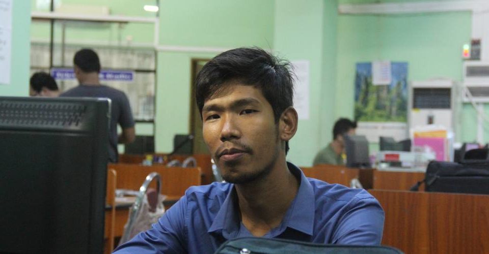 Root Investigative Agency co-founder Min Min pictured at his desk in the news agency’s Sittwe office. Photo: RiA