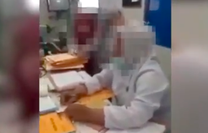A nurse at a hospital in Sidoarjo, East Java accused of injecting already deceased patient. Photo: Video screengrab
