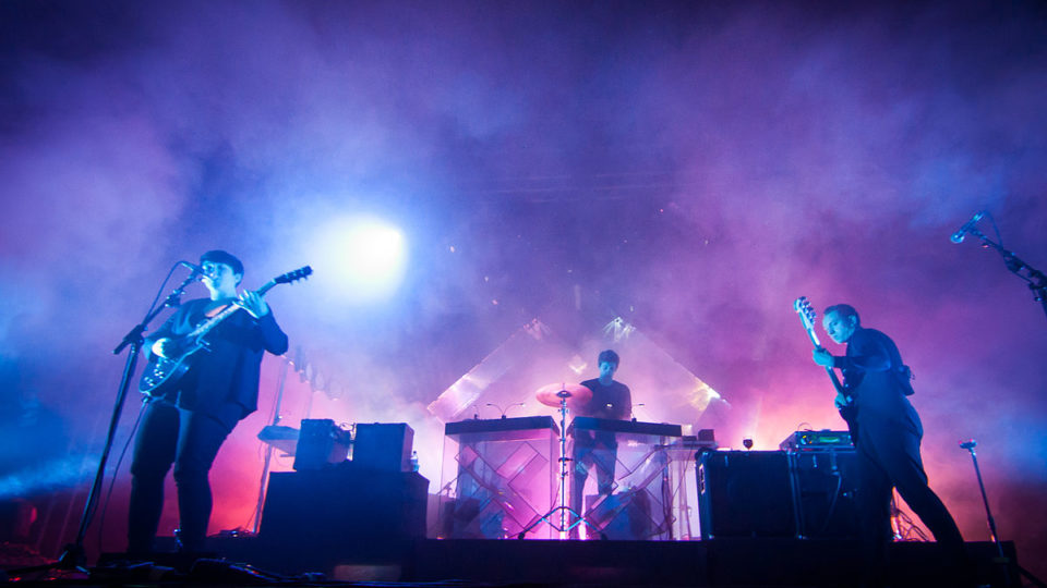 The xx performing at Ilosaarirock Festival in Joensuu, Finland, in 2012. Left to right: Romy Madley Croft, Jamie xx, Oliver Sim.