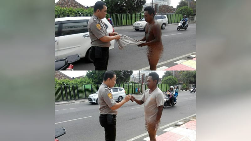 A police officer in Bandar Lampung, Indonesia giving his t-shirt to a naked homeless man. Photo: Instagram/@polisi_lampung
