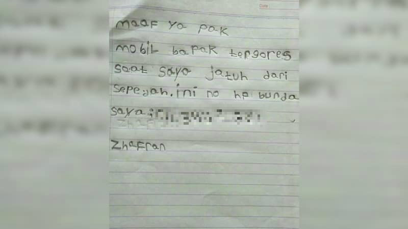 A handwritten apology note by a 6-year-old Indonesian boy after his bike scratched a parked car. Photo: Instagram