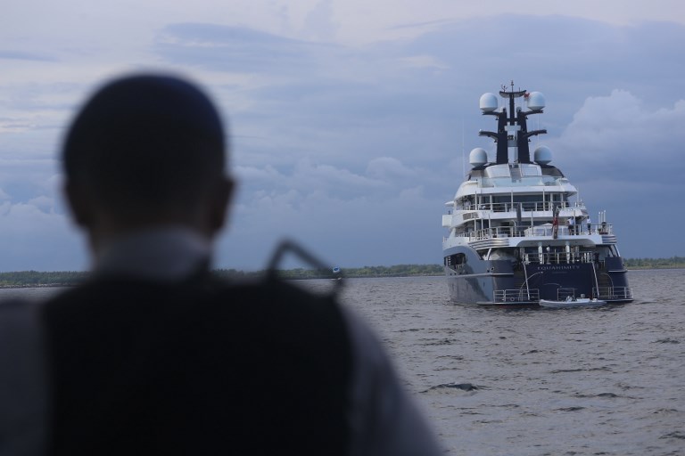 Indonesian officials prepare to board the luxury yacht ‘Equanimity’, reportedly worth some US$250 million and formerly owned by Jho Low, a former unofficial adviser to the Malaysian fund 1MDB, at Benoa Bay in Bali on February 28, 2018. Photo: AFP / Rully Prasetyo