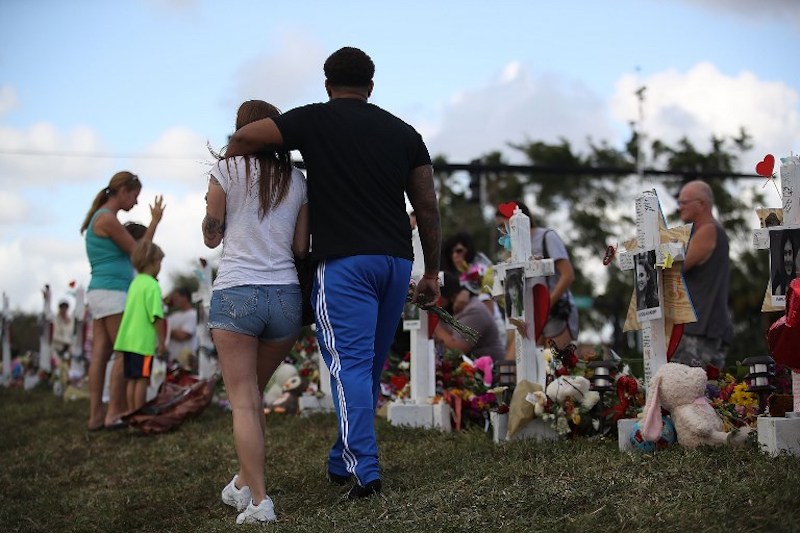 A makeshift memorial set up in front of the Douglas Stoneman High school on February 19. Photo: Joe Raedle / Getty Images / AFP