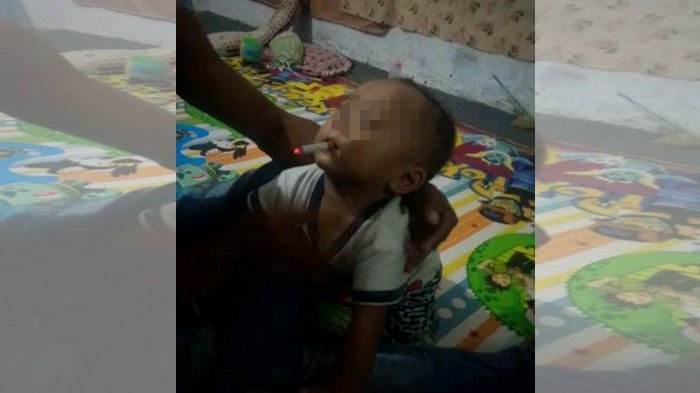 A 9-month-old baby in Indonesia with a lit cigarette in his mouth. Photo: Facebook