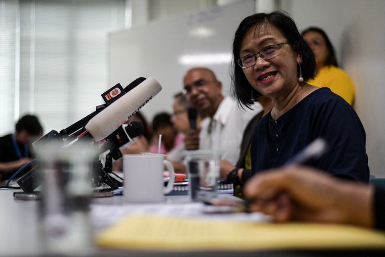 Maria Chin Abdullah, (R), former chairperson of the coalition of Malaysian NGOs and activist groups known as Bersih, that also translates as “clean” in the local Malay language, smiles during a press conference in Kuala Lumpur on March 6, 2018.
A prominent Malaysian activist will run as an opposition candidate on March 6 as a tough election battle looms against scandal-plagued Premier Najib Razak and his long-ruling coalition. / AFP PHOTO / Mohd RASFAN