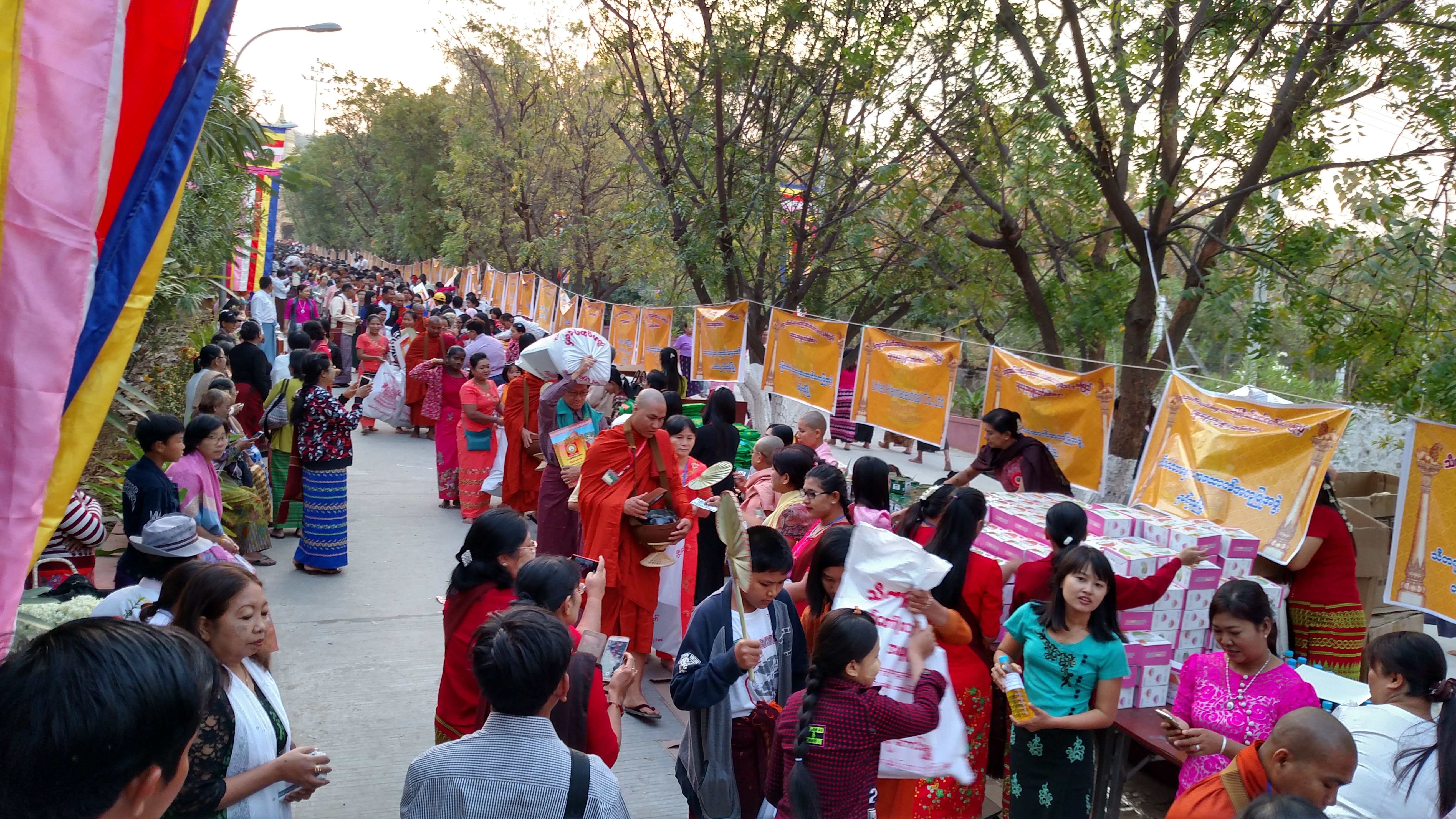 Monks gather alms at Sitagu Sayadaw's birthday celebration