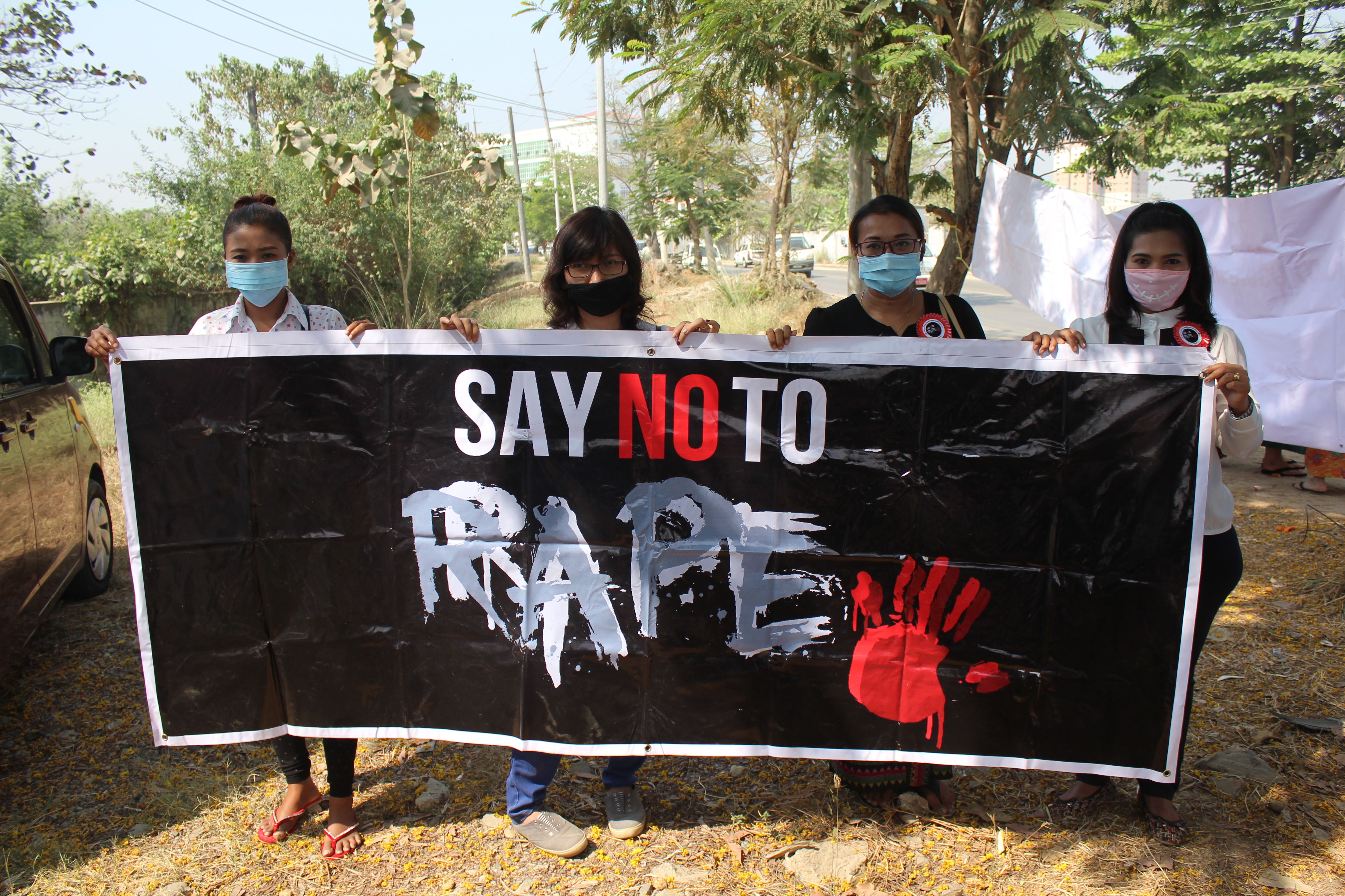 Women's Defense Association members attend a protest