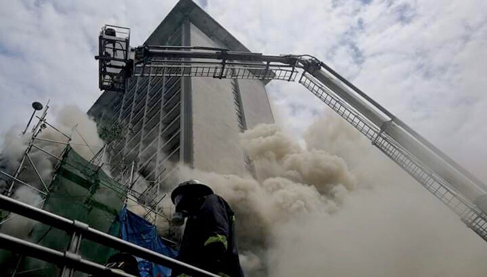 Firefighters work on containing a fire that hit the Waterfront Manila Pavilion Hotel on UN Avenue in Manila on Sunday. Early reports place the number of fatalities at 4, while 6 of the injured were brought to the nearby Manila Doctor’s Hospital.  PHOTO: ABS-CBN News