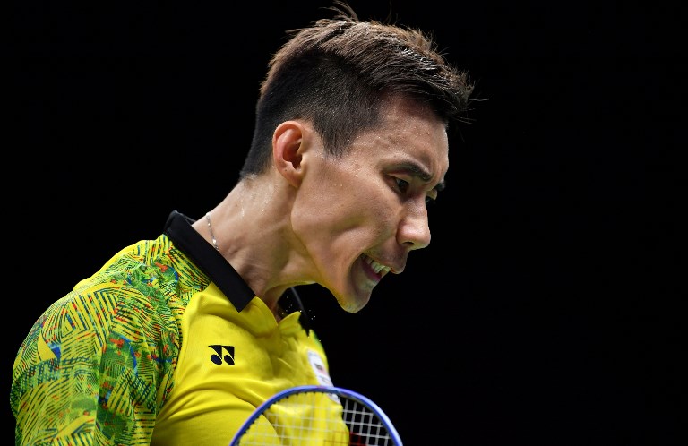 Malaysia’s Lee Chong Wei reacts while playing against India’s Srikanth Kidambi during the men’s badminton final at the 2018 Gold Coast Commonwealth Games on the Gold Coast on April 15, 2018. / AFP PHOTO / Saeed KHAN