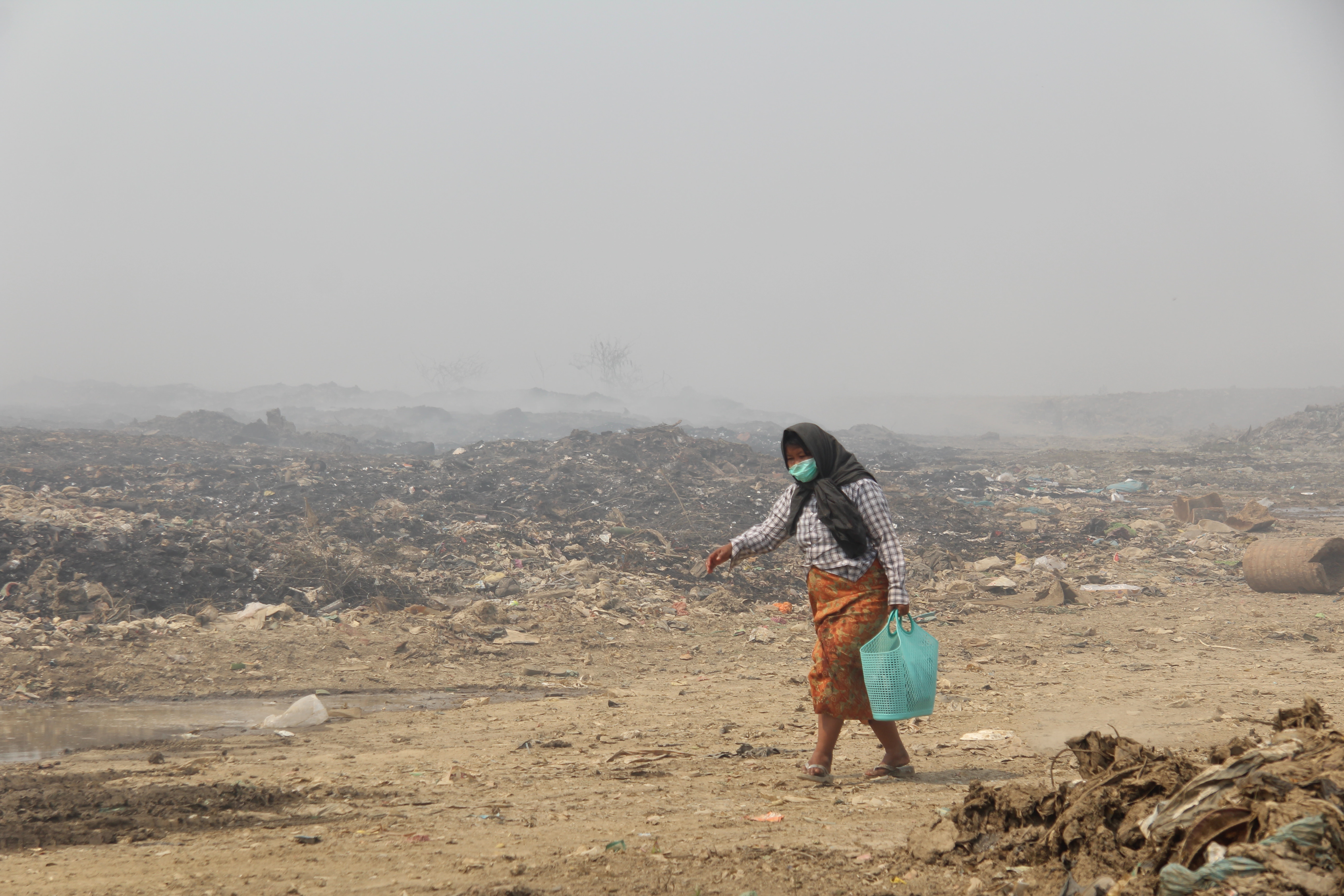 volunteer carries supplies