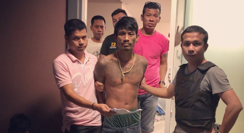 The suspect being taken into custody.