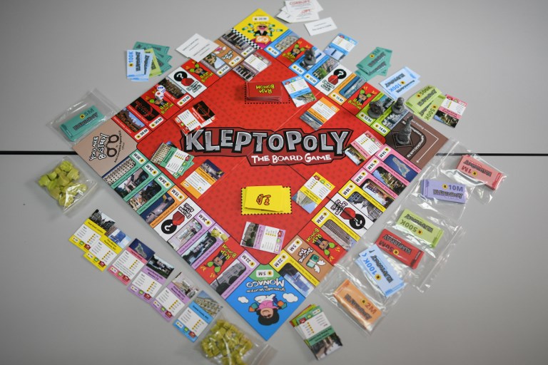 This photo illustration taken on April 17, 2018 shows the Kleptopoly board game displayed at the Centre to Combat Corruption and Cronyism (C4) office in Petaling Jaya, near Kuala Lumpur.
“Kleptopoly”, a Malaysian board game based on “Monopoly”, is poking fun at a massive financial scandal ahead of elections, featuring a motley crew of figures central to the controversy and items allegedly bought with looted money.  / AFP PHOTO / Mohd RASFAN / TO GO WITH Malaysia-politics-corruption-game