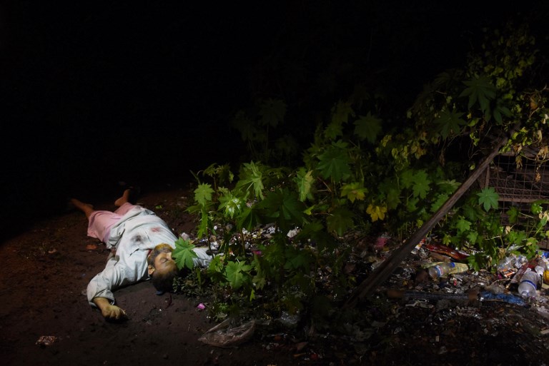 This photo taken on May 18, 2018 shows the dead body of a Bangladeshi alleged drug dealer after a gun battle with law enforcement in Chittagong. (Photo from AFP)