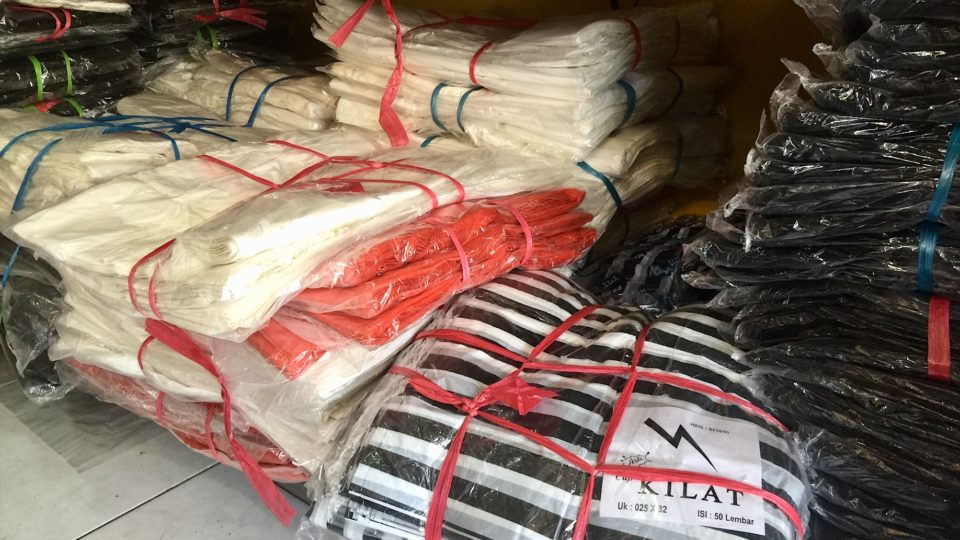 Packs of bags on a shelf at a plastic shop in Kerobokan. Photo: Coconuts Bali