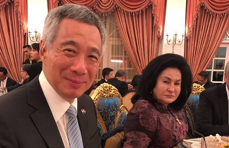 Prime Minister Lee Hsien Loong smiling politely next to an unsmiling (or is she smiling?) Rosmah Mansor. Photo: @NajibRazak / Twitter