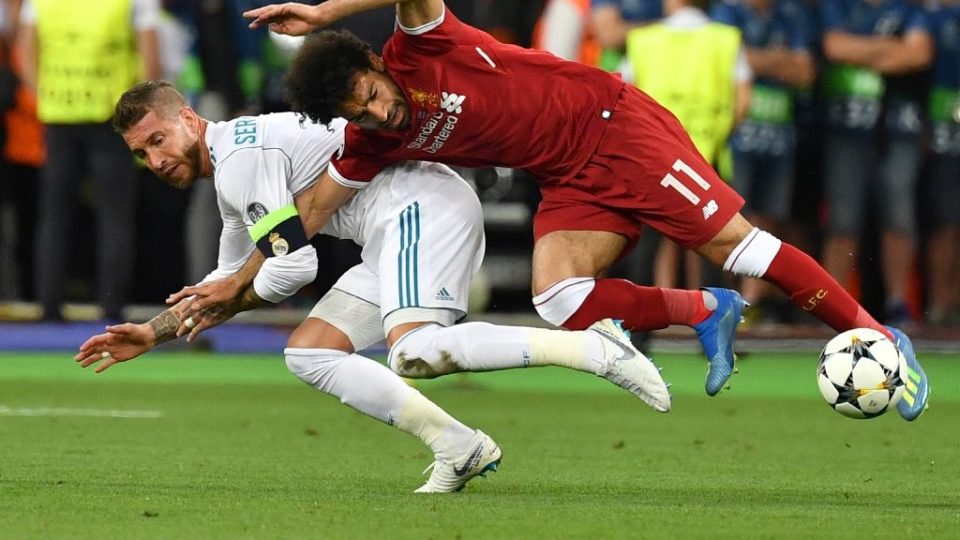 Liverpool’s Egyptian forward Mohamed Salah (R) falls with Real Madrid’s Spanish defender Sergio Ramos leading to Salah being injured during the UEFA Champions League final football match between Liverpool and Real Madrid at the Olympic Stadium in Kiev, Ukraine, on May 26, 2018. 
Photo: GENYA SAVILOV / AFP