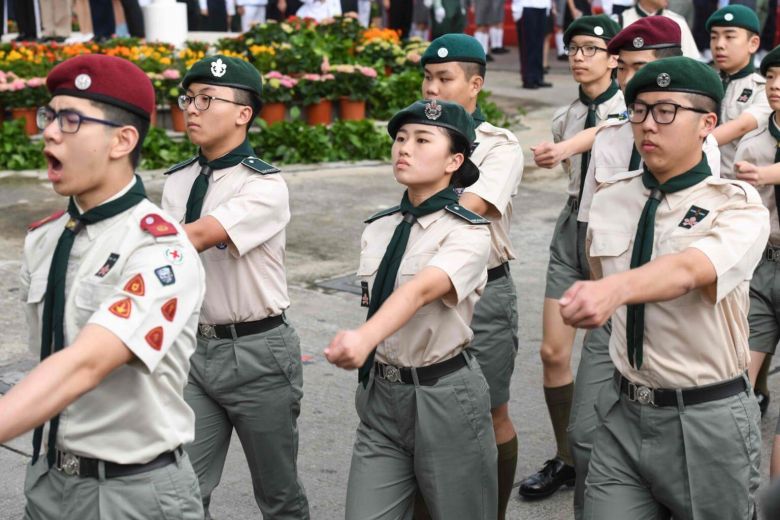 This photo from May 4, 2018 shows members of a military-style youth group using the British-style quick march as they take part in an annual flag raising ceremony in Hong Kong. PHOTO: AFP