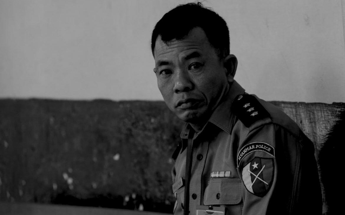 Myanmar captain Moe Yan Naing waits outside the courthouse before attending the ongoing trial of two detained journalists in Yangon on April 20, 2018. Photo: Sai Aung MAIN / AFP