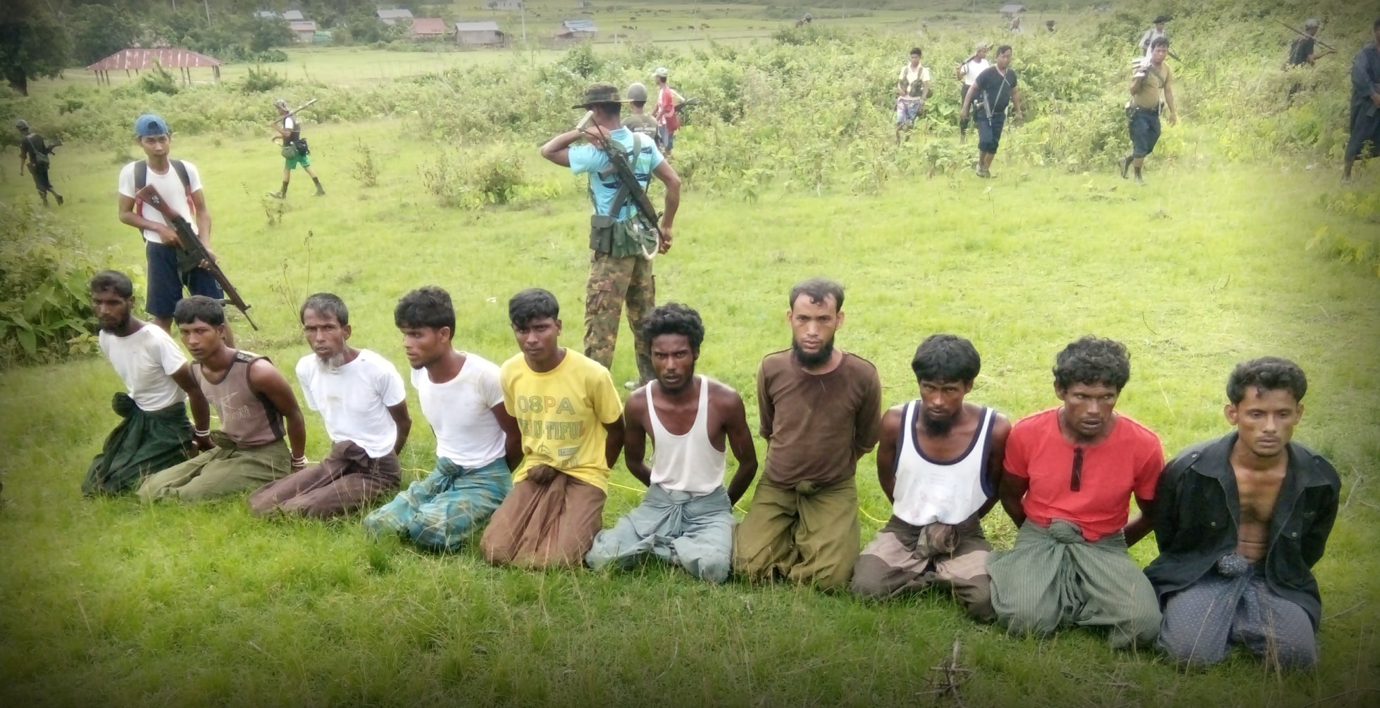 Police Captain Moe Yan Naing, is the figure on the top right. He walks with his rifle over his shoulder.