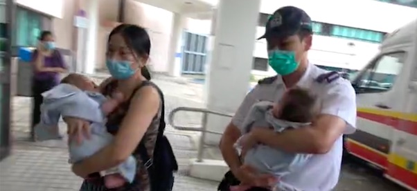 A teenage mom was arrested on suspicion of child cruelty after leaving her 5-month-old twins unattended. Screengrab via Apple Daily.