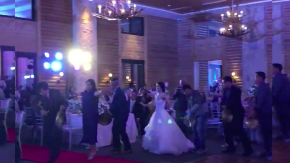 Wedding guests dance the torayan, an Igorot traditional dance. Screenshot via Kevin Narciso’s Twitter.