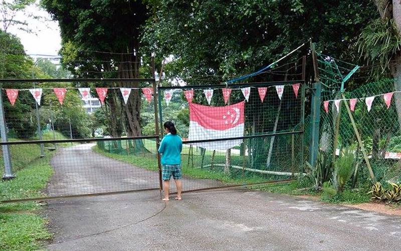 An agency lodging where the locked front gate prevents helpers from leaving the premises unaccompanied. Photo: FDW in Singapore / Facebook