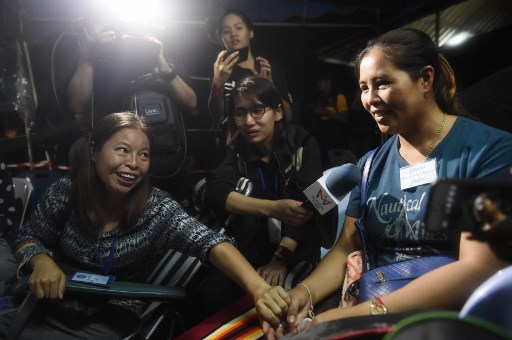 Family members celebrate while camping out near Tham Luang cave following news all members of children’s football team and their coach were alive in the cave at Khun Nam Nang Non Forest Park in the Mae Sai district of Chiang Rai province late July 2, 2018. Photo: AFP