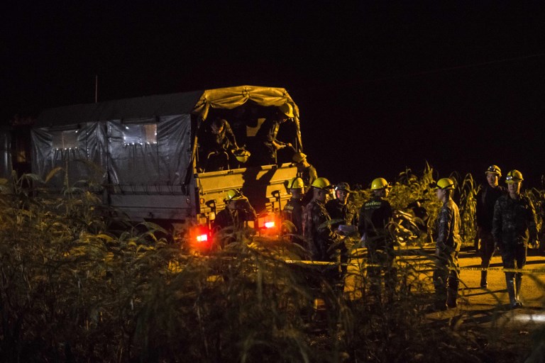 Thai soldiers arrive on military truck at the Luang Cave area as the operations continue for those still trapped inside the cave in Khun Nam Nang Non Forest Park. Photo: AFP