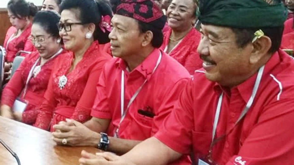 Wayan Koster and Tjokorda Oka Artha Ardhana Sukawati accompanied by their waives attend a plenary meeting announcing their official win for the governor’s office for the 2018-2023 term in Denpasar on July 24, 2018. Photo: @kosteraceofficial 