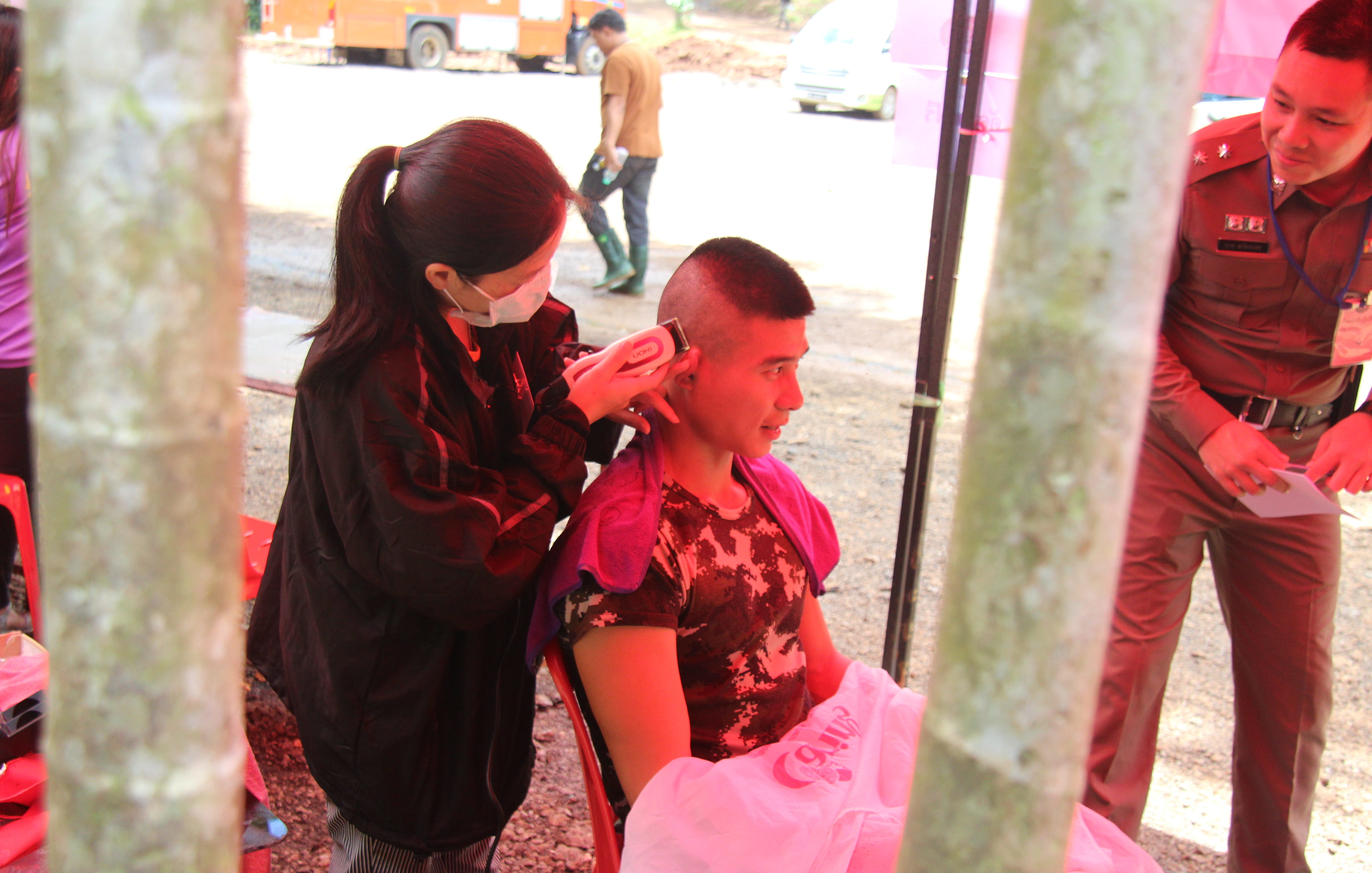 A young solider gets a haircut at the Luang cave rescue camp on July 3, 2018. Photo: Jacob Goldberg