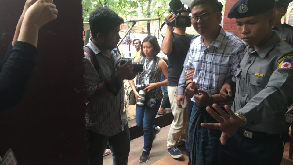 Reuters reporter Wa Lone is escorted from the Insein Township courthouse after testifying on July 16, 2018. Photo: Jacob Goldberg