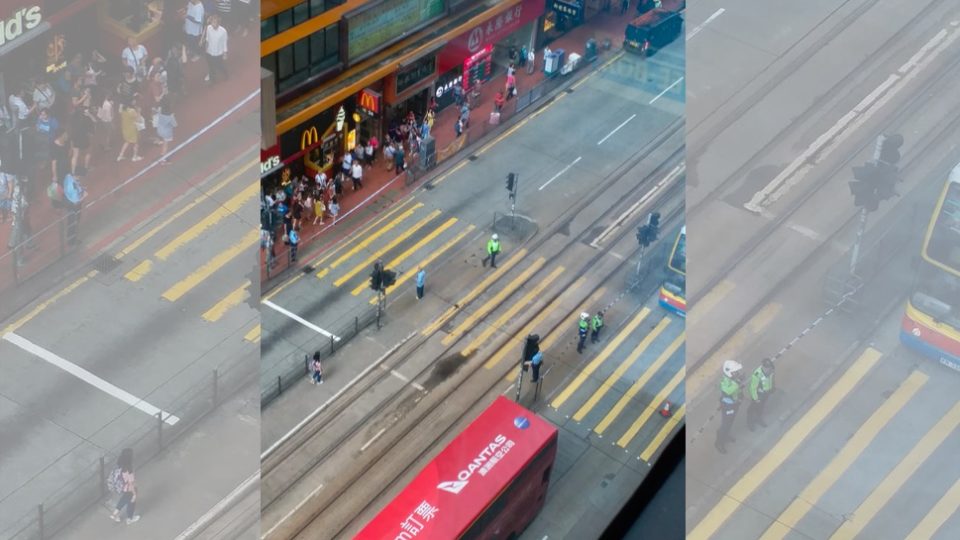 Police block King’s Road in North Point after glass from a building rains down on the street. Photo via Facebook.