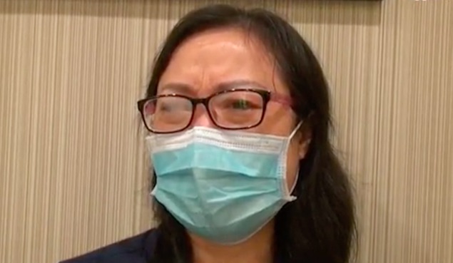 A 49-year-old mom surnamed Wong tearfully tells a newspaper that she just wants her money back so that her daughter can study. Screenshot via Apple Daily