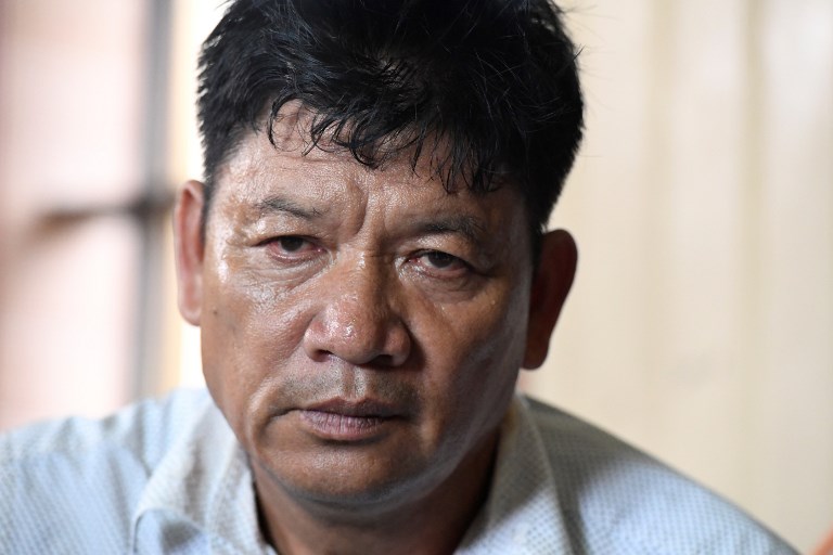 Doan Van Thanh, father of Vietnamese national Doan Thi Huong, is interviewed from his home in Nam Dinh province south of Hanoi on August 16, 2018 while following news on the trial of Huong in Malaysia for her alleged role in the assassination of Kim Jong-Nam, the half-brother of North Korean leader Kim Jong-Un.
A Malaysian court ruled on August 16 the murder trial of two women accused of assassinating the half-brother of North Korea&#8217;s leader can proceed &#8212; in a blow to their families who insist the pair were tricked into carrying out the dramatic hit.
 / AFP PHOTO / Nhac NGUYEN