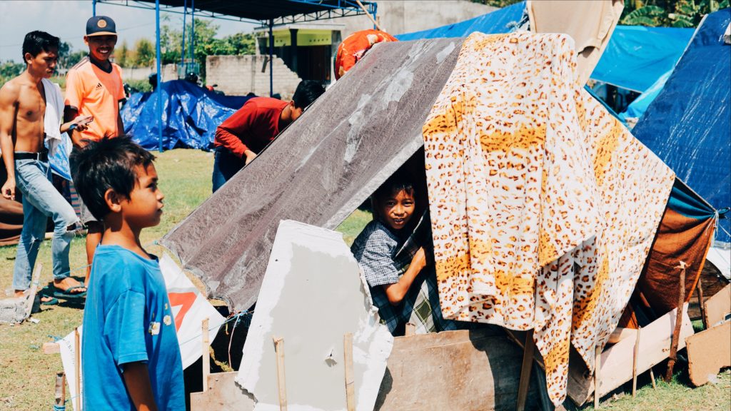 Makeshift tents have been fashioned out of whatever materials are available, like this one in West Lombok. Photo: Coconuts Bali