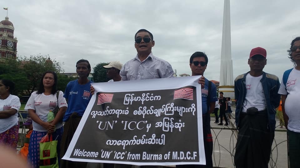 Protesters arrested in downtown Yangon shortly after calling for the arrest of Myanmar’s “murderous generals” on Aug. 31, 2018. Photo: Michael Nei Lian