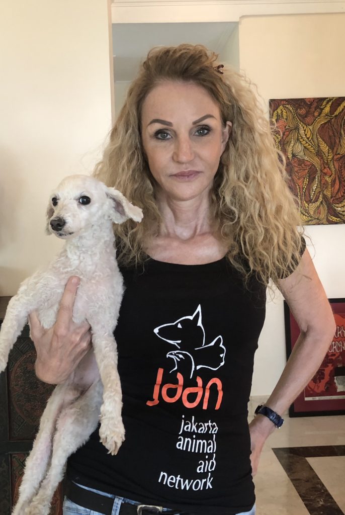 Jakarta Animal Aid Network (JAAN) co-founder Natalie Stewart holding up a rescued dog, Little. Photo: Andra Nasrie