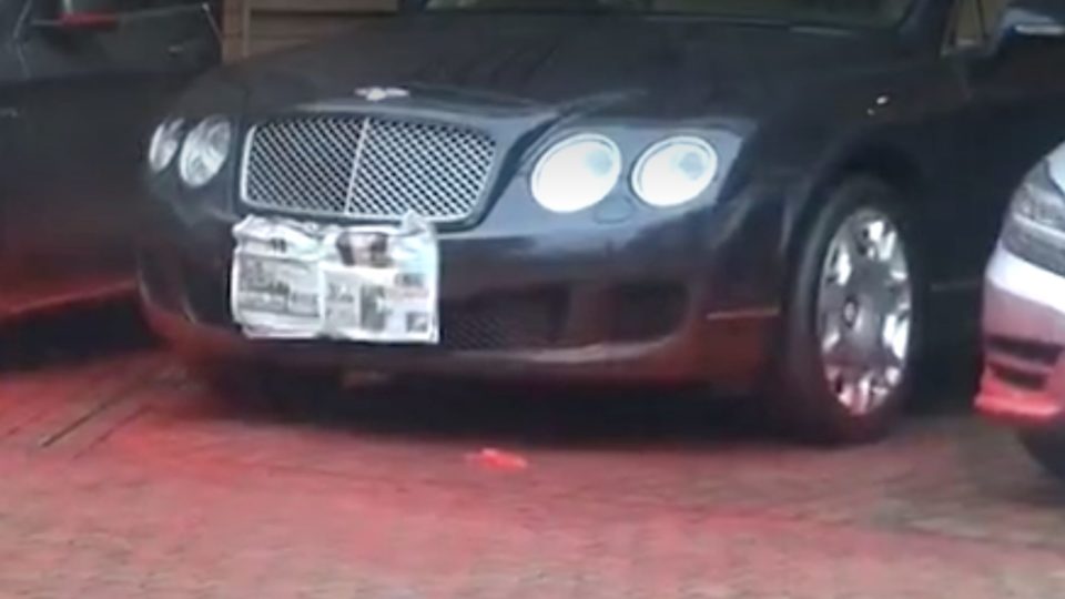 A pic of one of the cars hit by yesterday’s ‘paint bomb’ attack. Picture via Apple Daily video. 