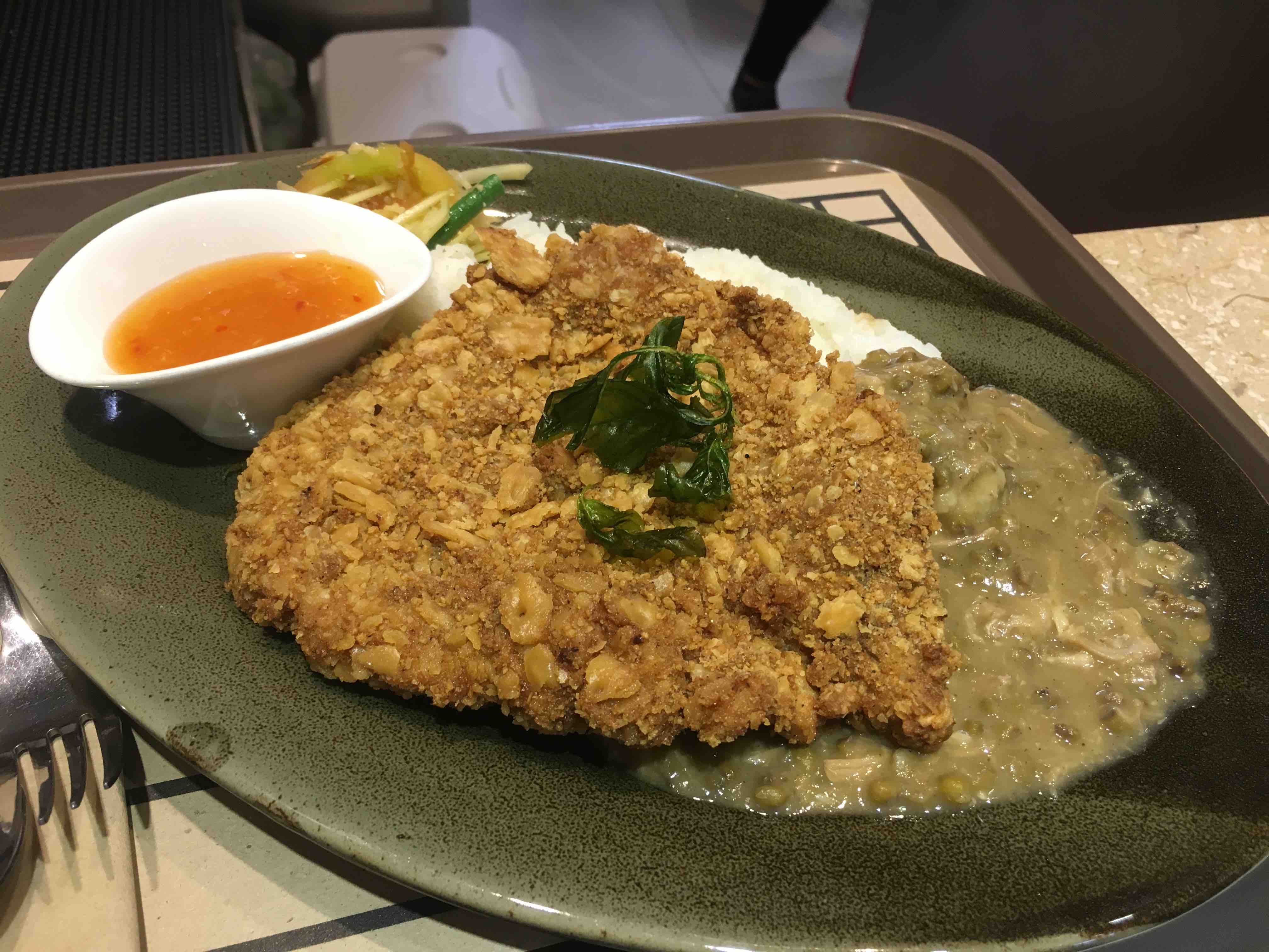 Pork chop with monggo and papaya salad. (Photo: Therese Reyes)