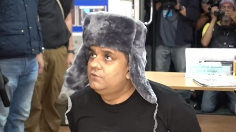 Mozambican fugitive Momade Assif Abdul Satar is questioned by Thai police. Screenshot: Tourist Police